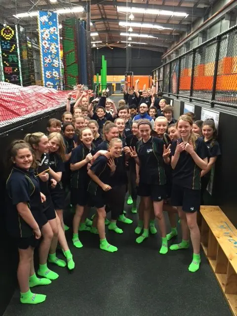 School group enjoying an activity at Jump & Climb