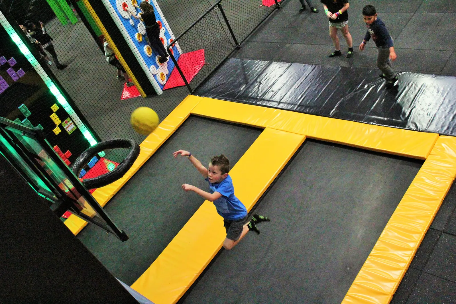 Slam dunk trampoline activity at Jump & Climb